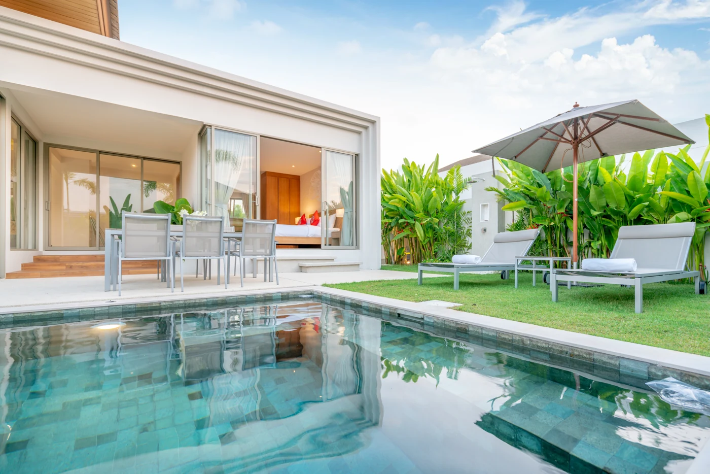 Tropical home and swimming pool, illustrative property photograph