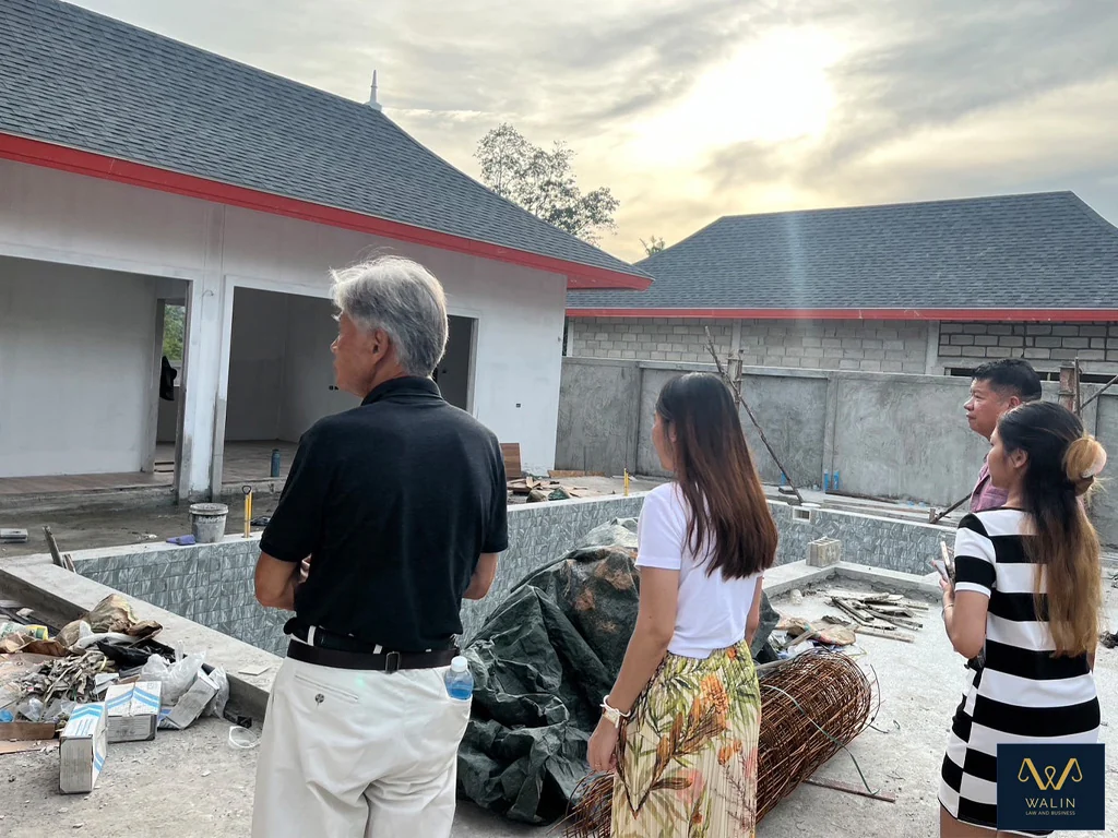 Visiting a residential property under construction with clients.
